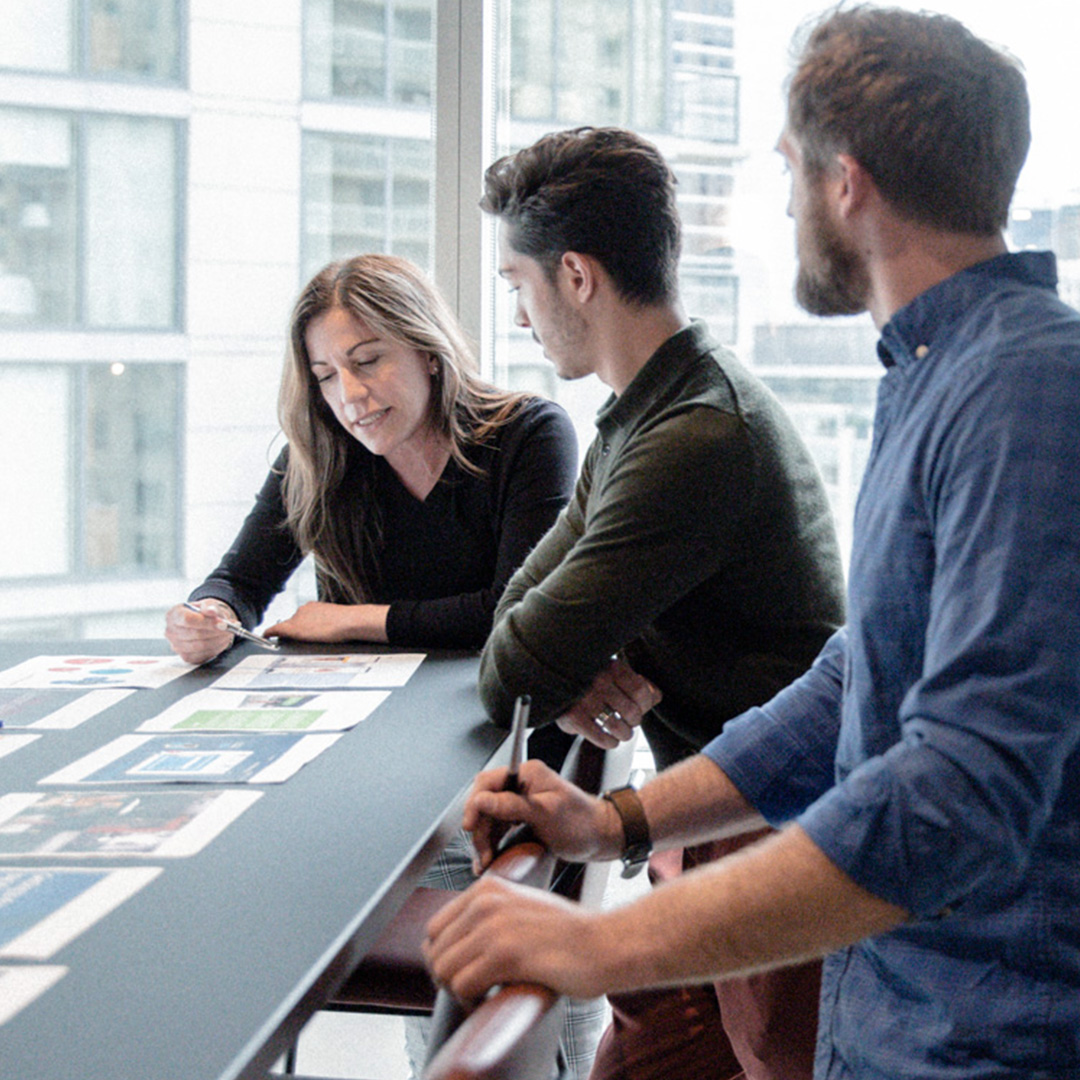 woman and men working at table