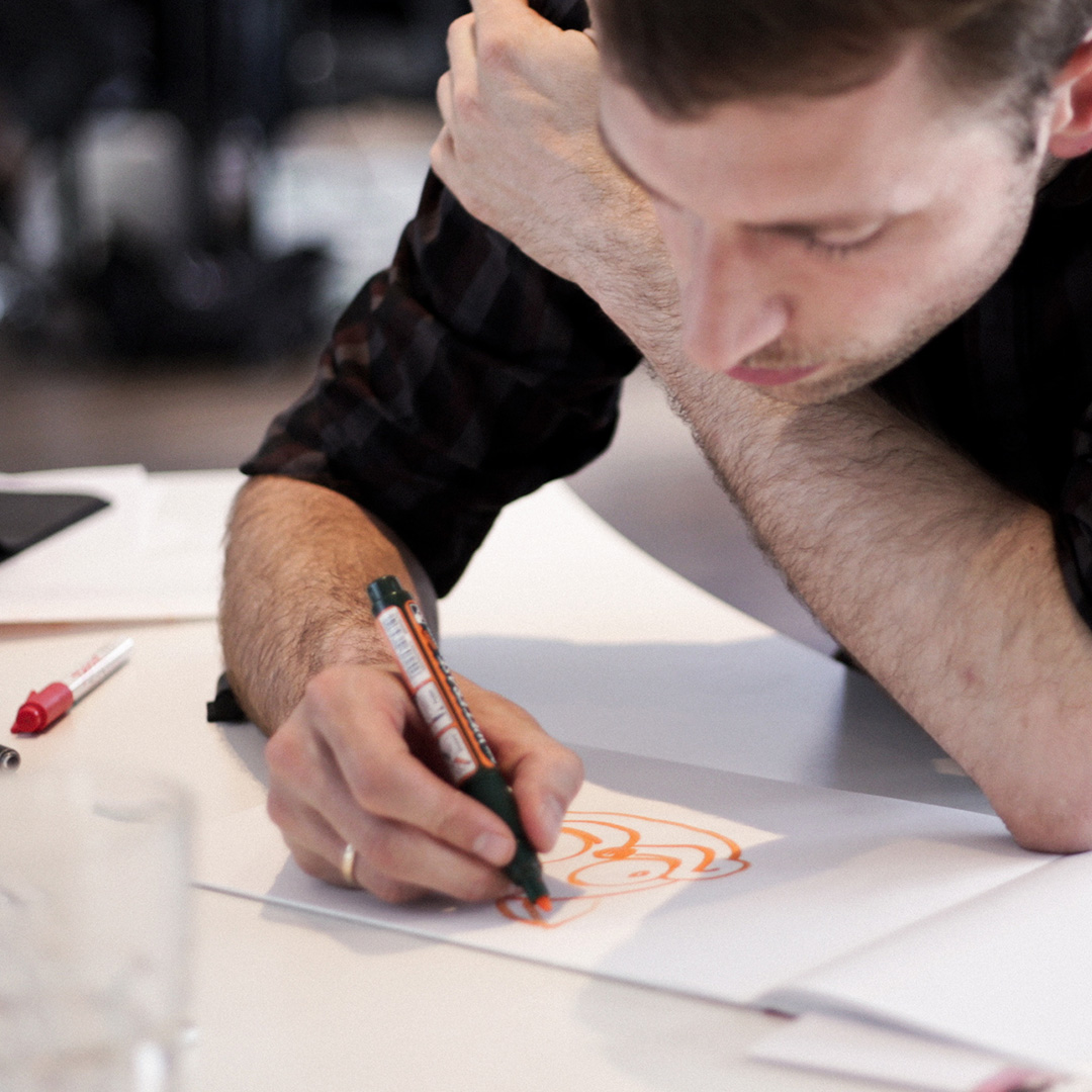 Man drawing designs