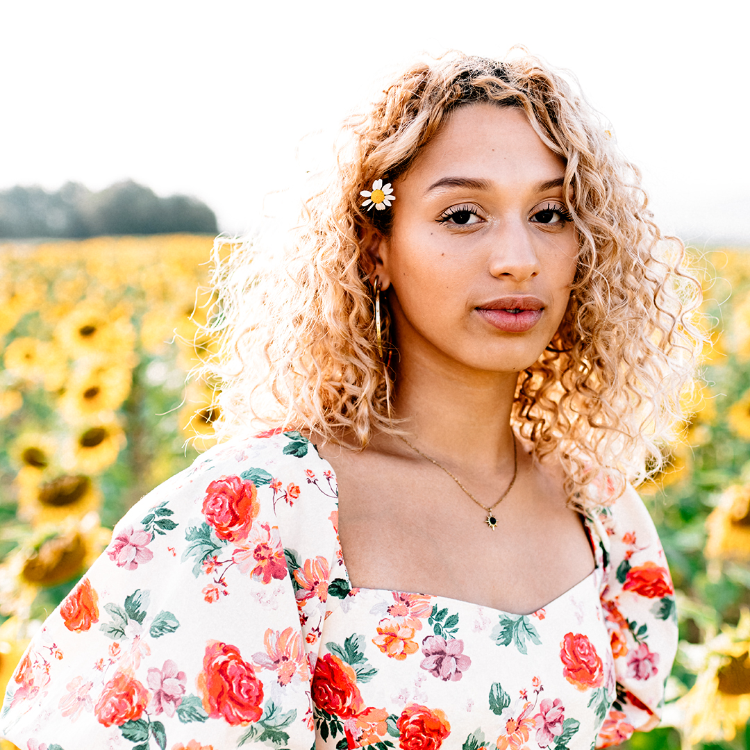 Woman in dress with sunflowers