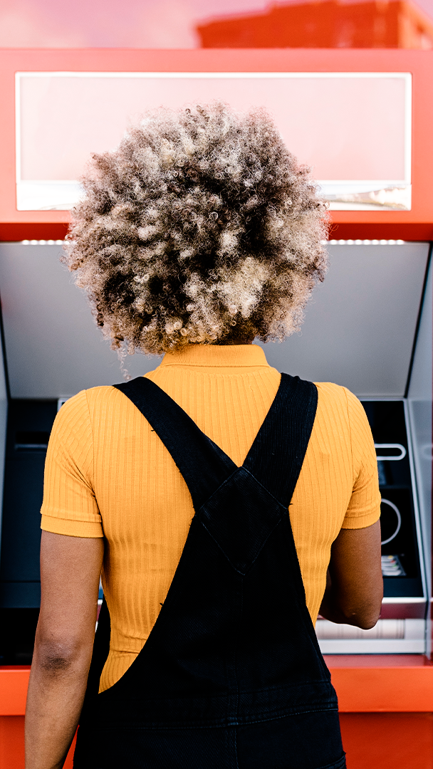 Woman using ATM
