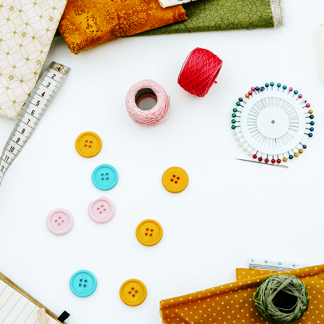 Sewing needles, thread and buttons