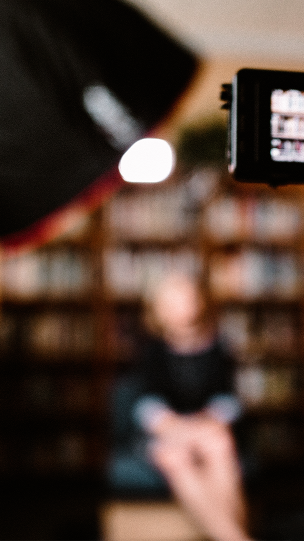 camera filming interview of female