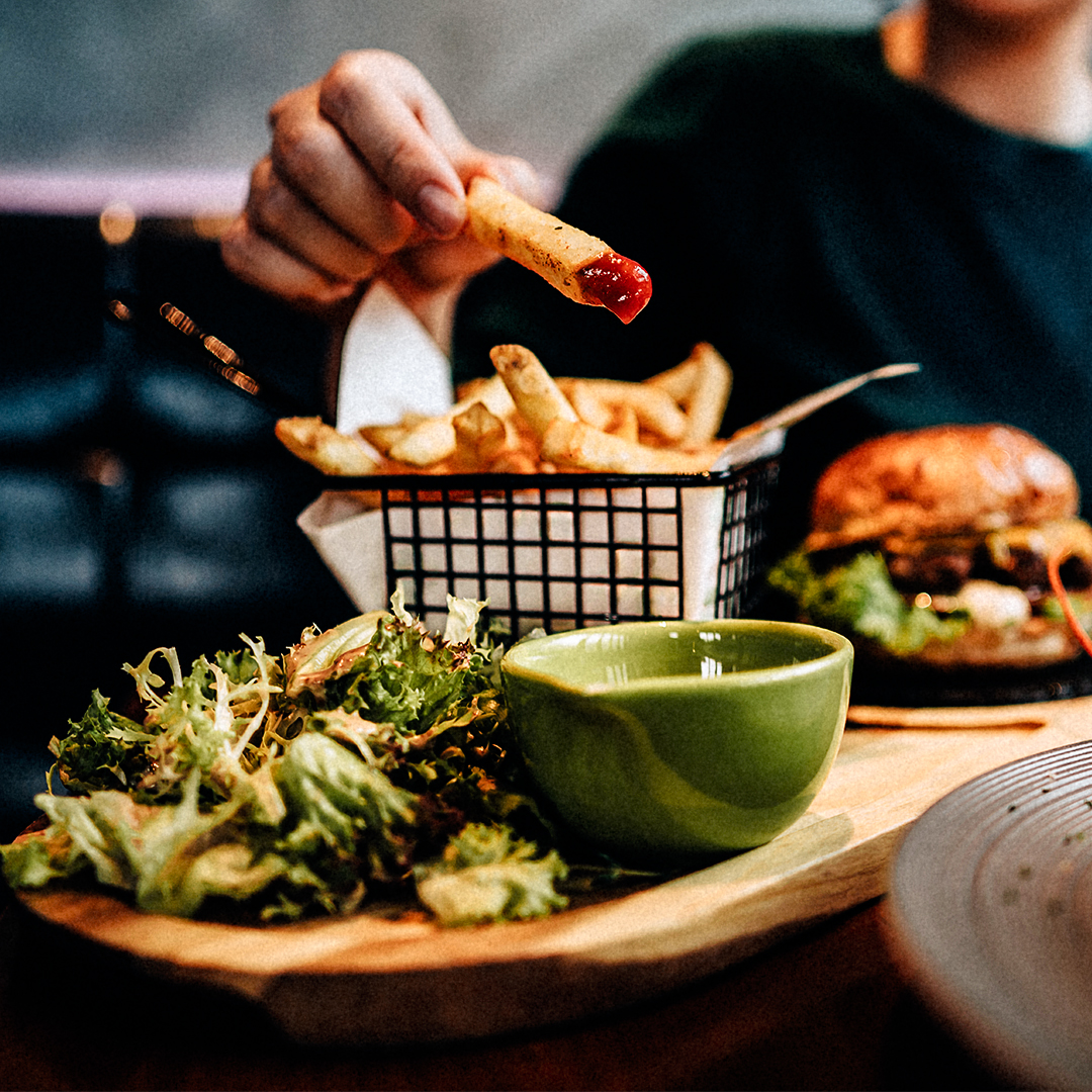 person eating french fries