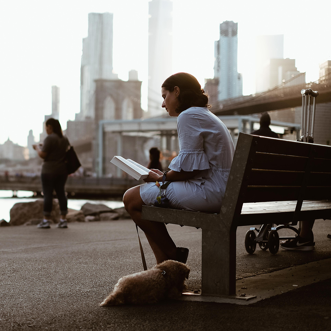 Woman sitting on park bench