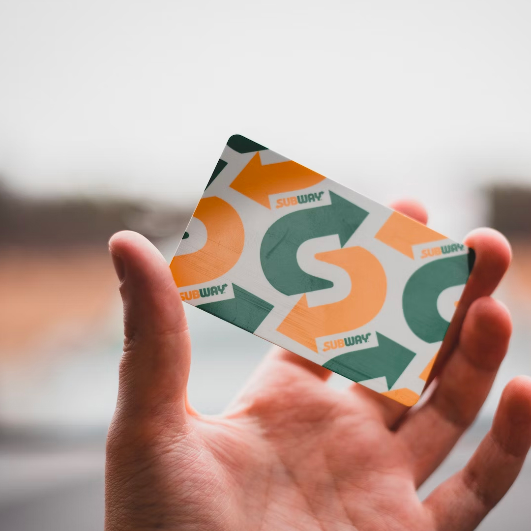Holding a Subway loyalty card