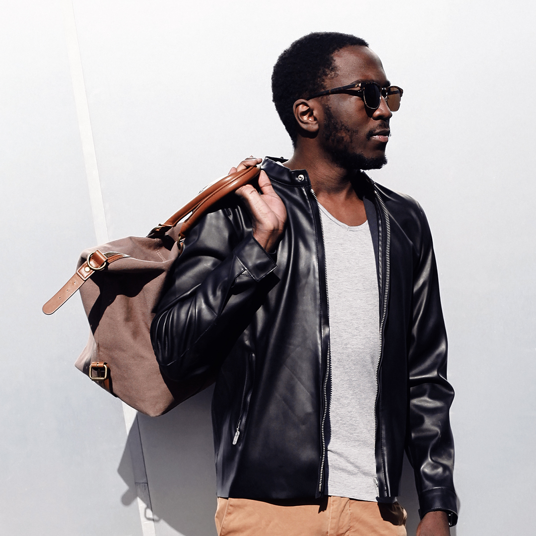 Backpack slung on man's arm