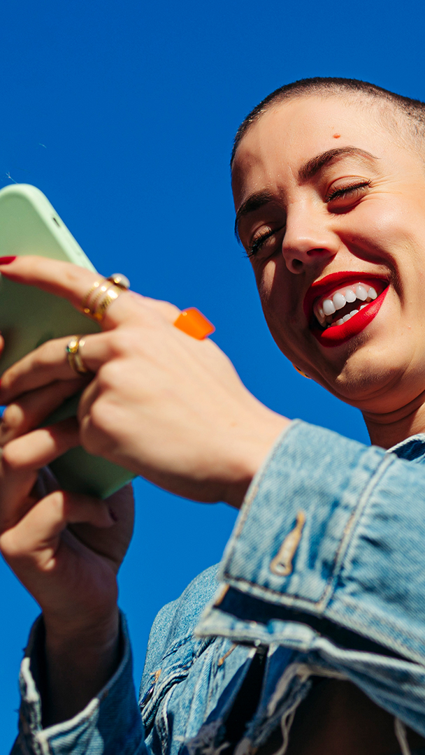 bald woman on phone