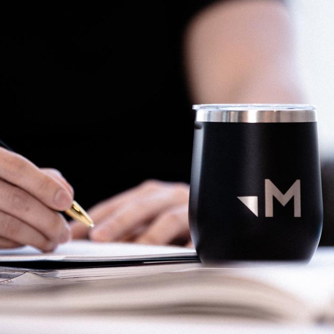 Merkle drink tumbler on table