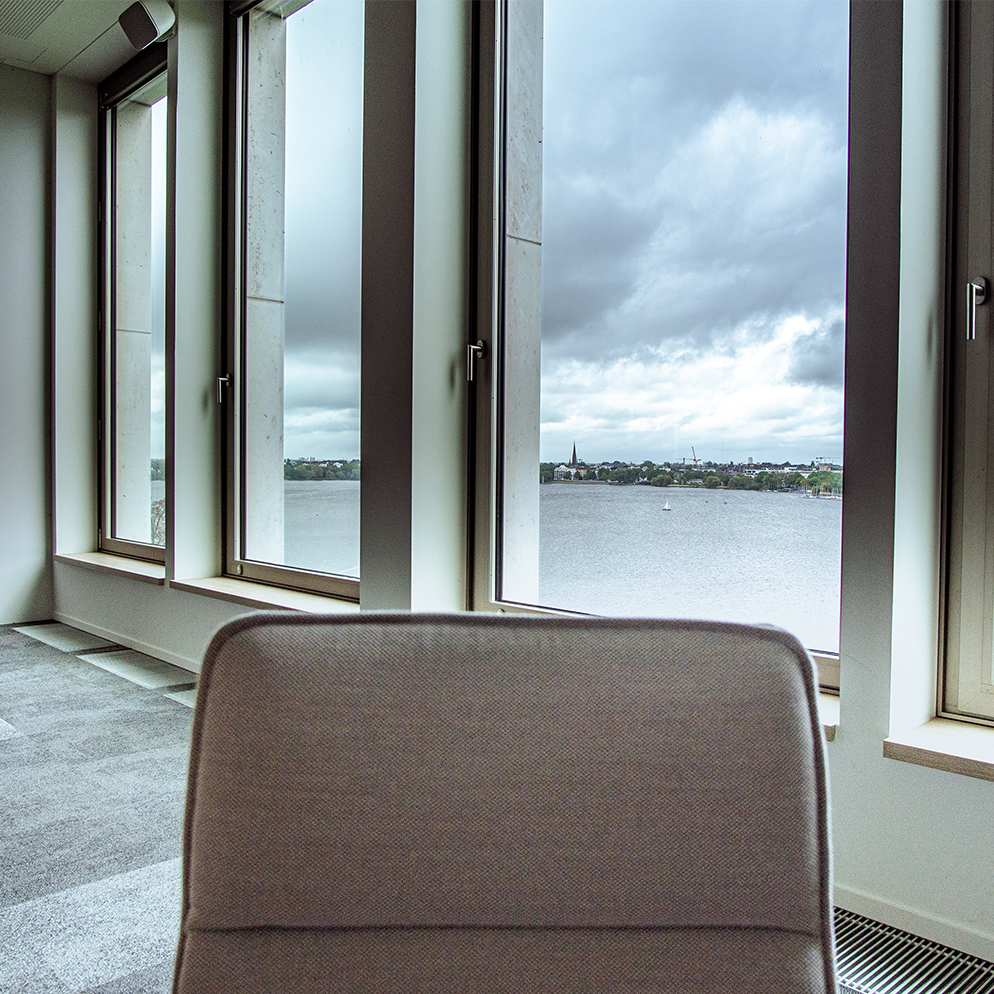 Office chair in front of windows
