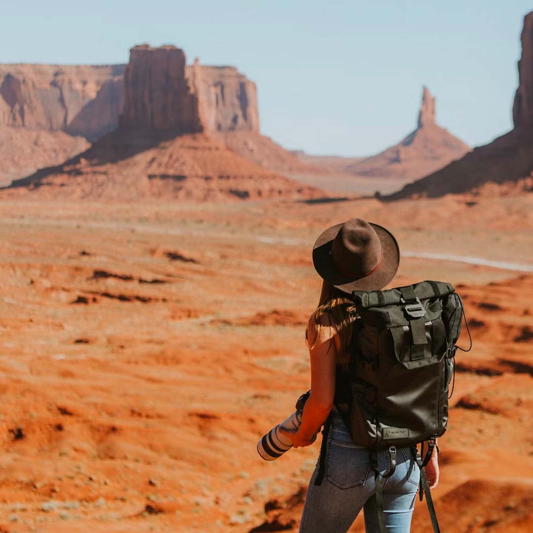 Woman hikes in Monument Valley