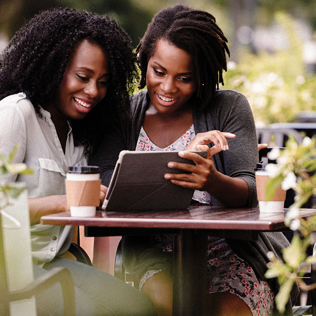 Ladies looking at iPad