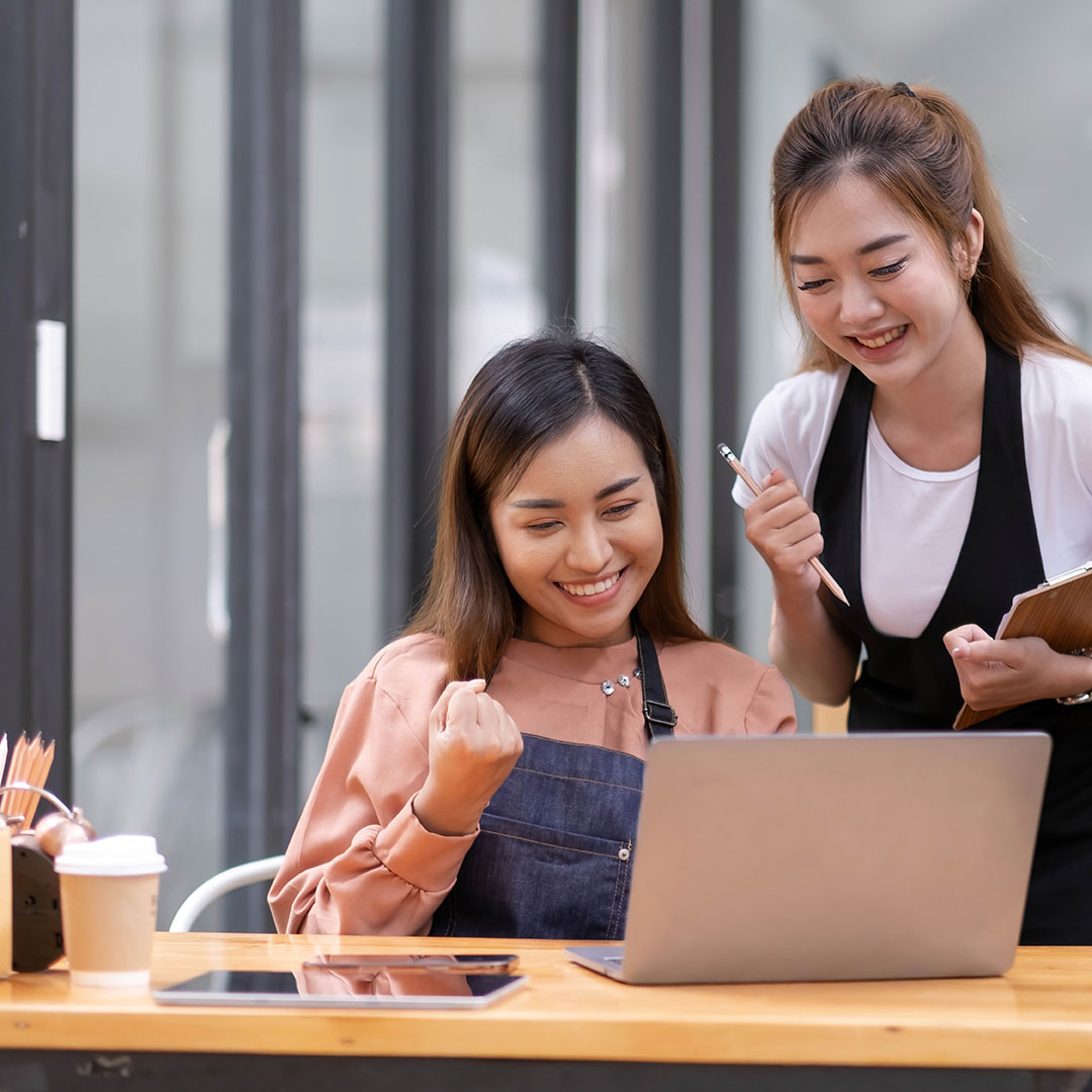2 Ladies looking at the Laptop