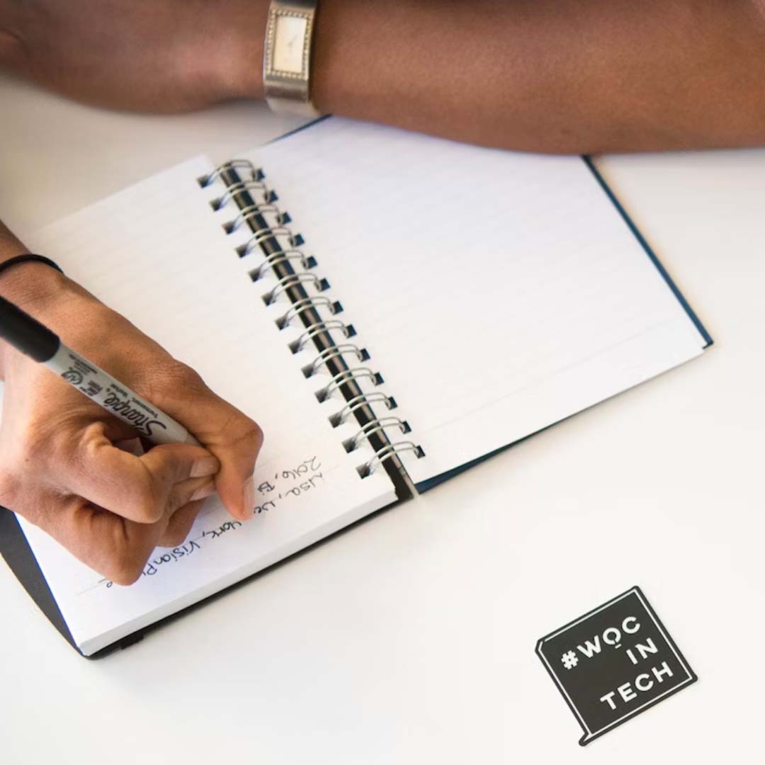 Women writing in notebook