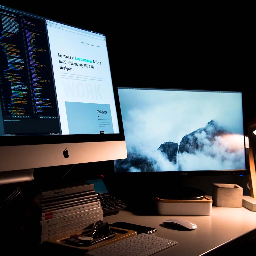 Monitor showing code and website