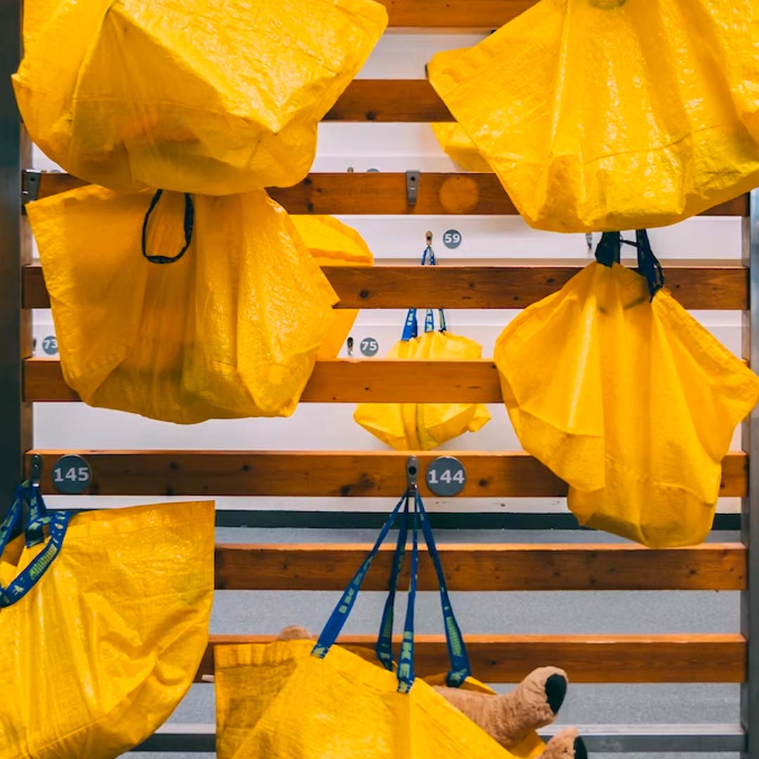 Yellow Ikea bags hanging up