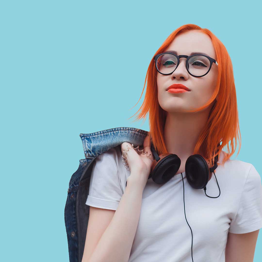 Girl with jean jacket over shoulder