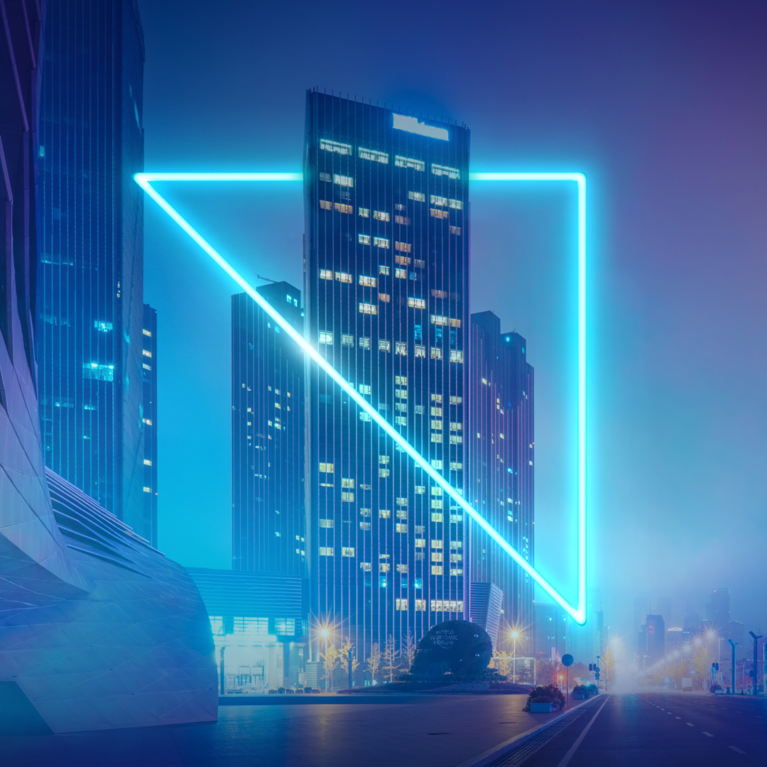 Neon triangle and skyscraper