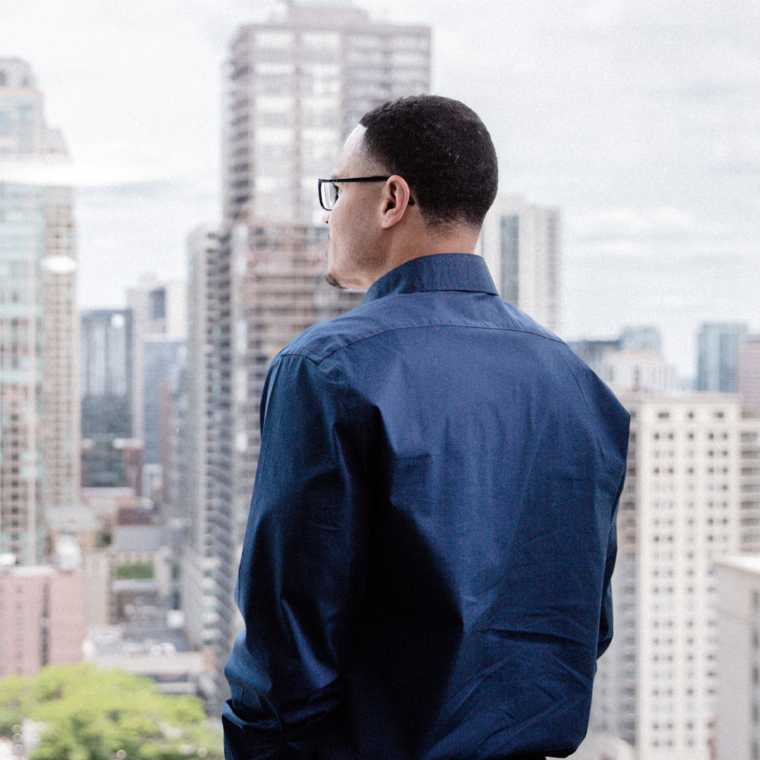 Man glances out office window