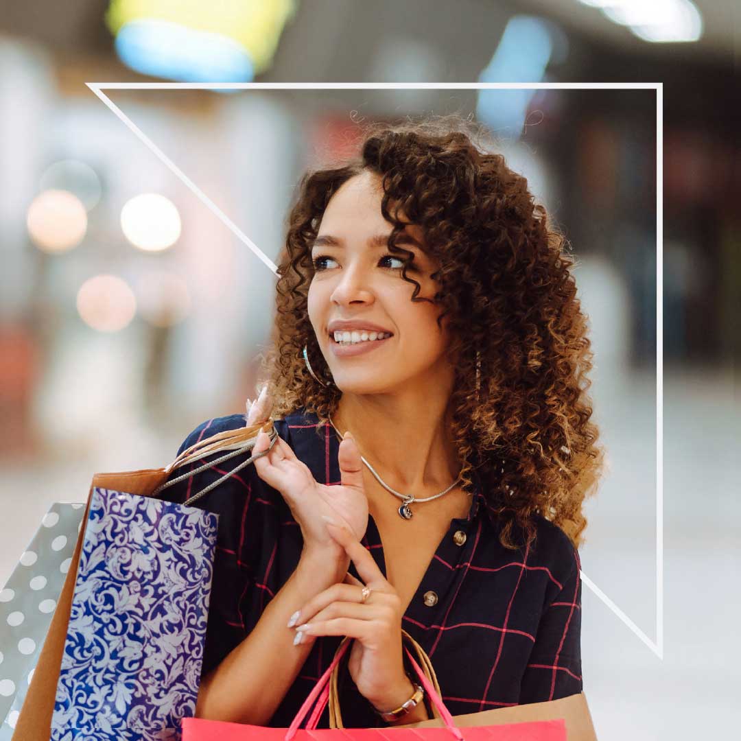 Woman with shopping bags on shoulder