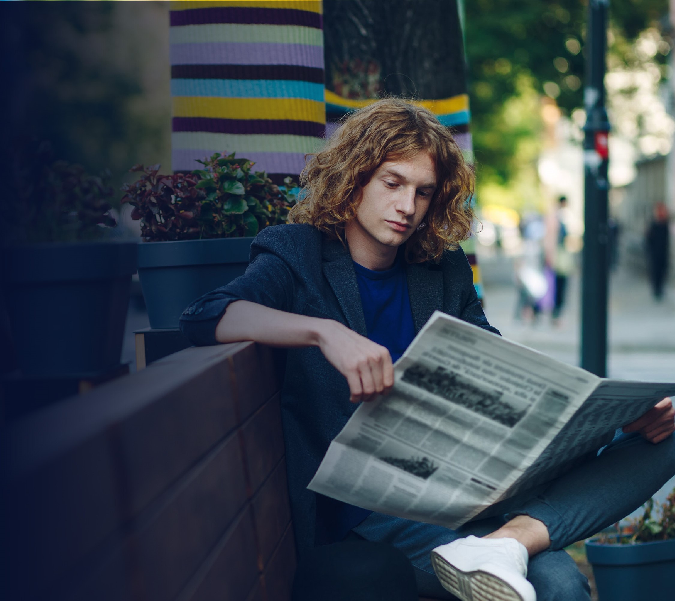 person reading newspaper