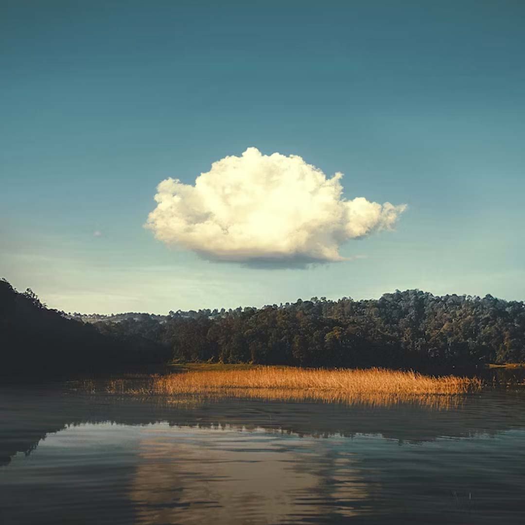 Lone cloud above a lake