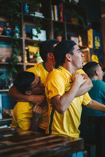 Football fans in yellow jerseys