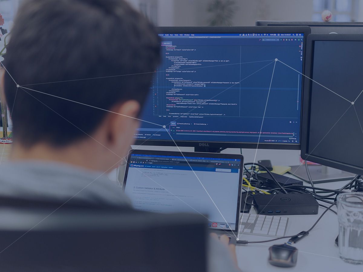 Merkle employee sits in front of computer and many data are shown