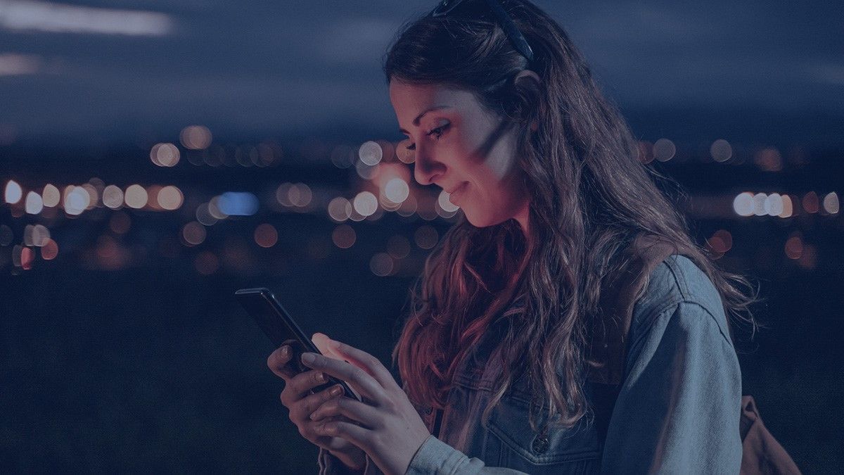 Woman holding Android smartphone